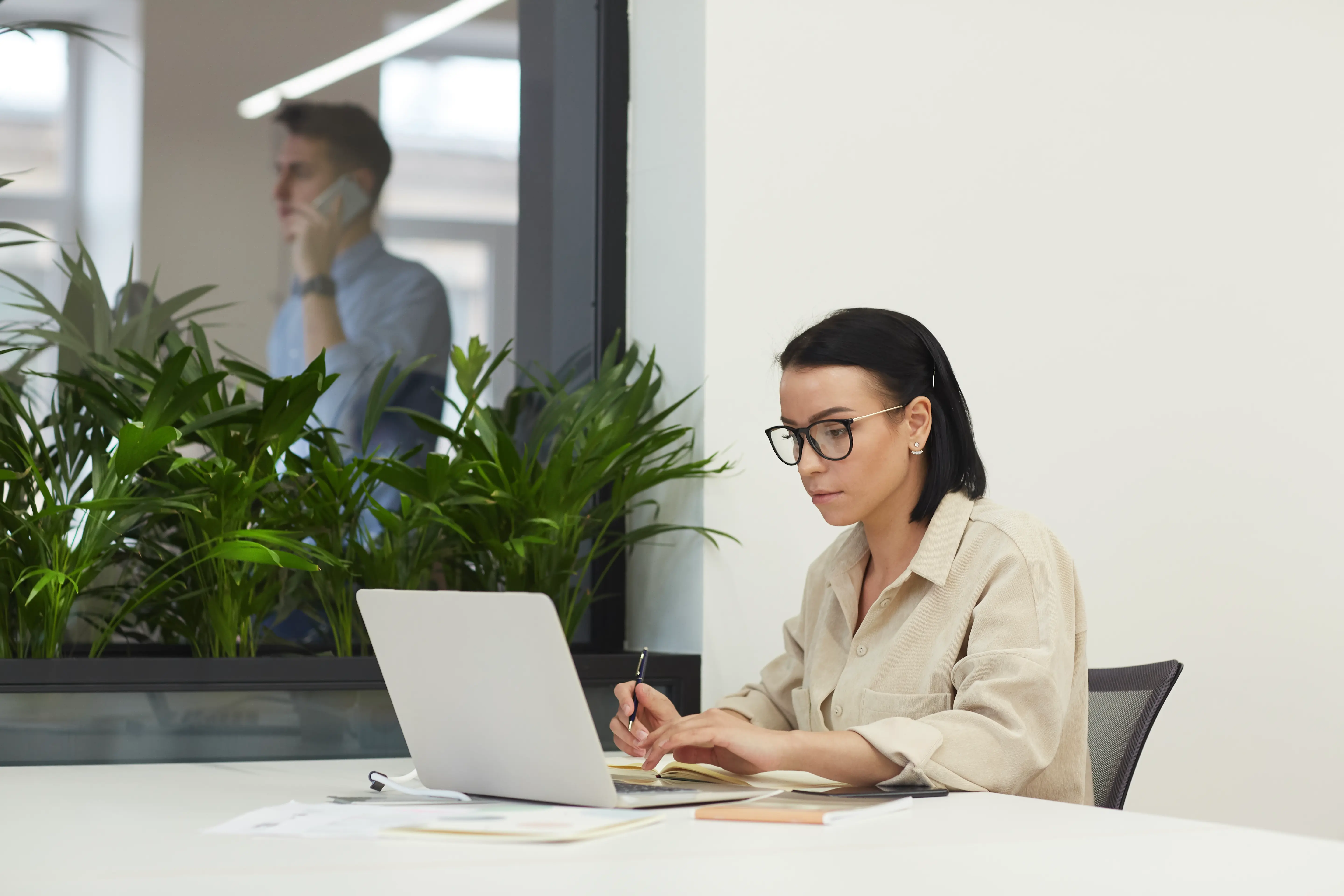 businesswoman-with-laptop-at-office-2022-02-02-04-51-44-utc.webp